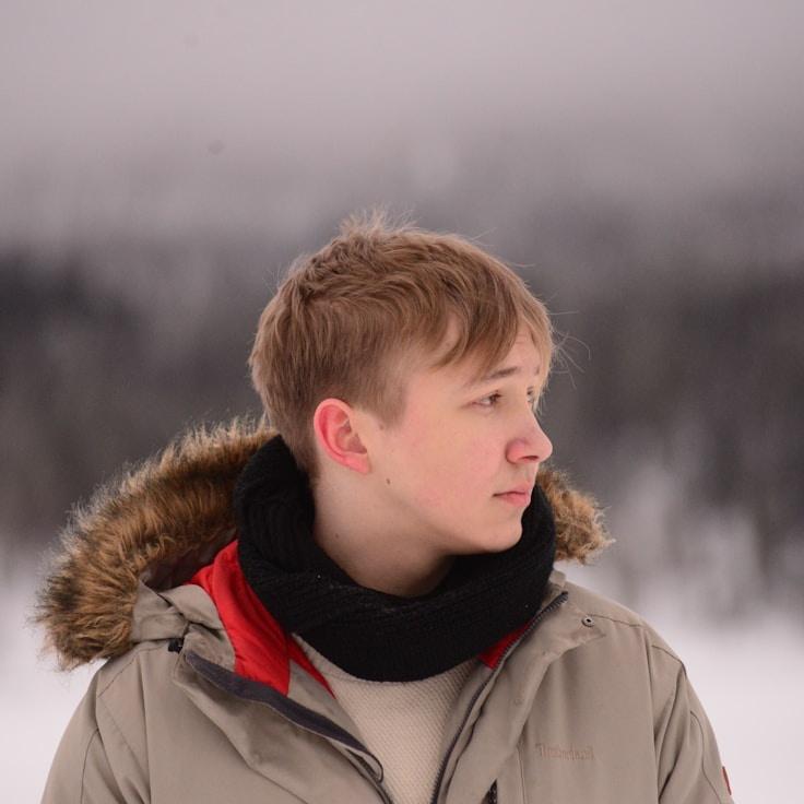 Alex Rivera, Lead Design Curator at Cyra Lithium Center, reviewing corporate floral arrangements